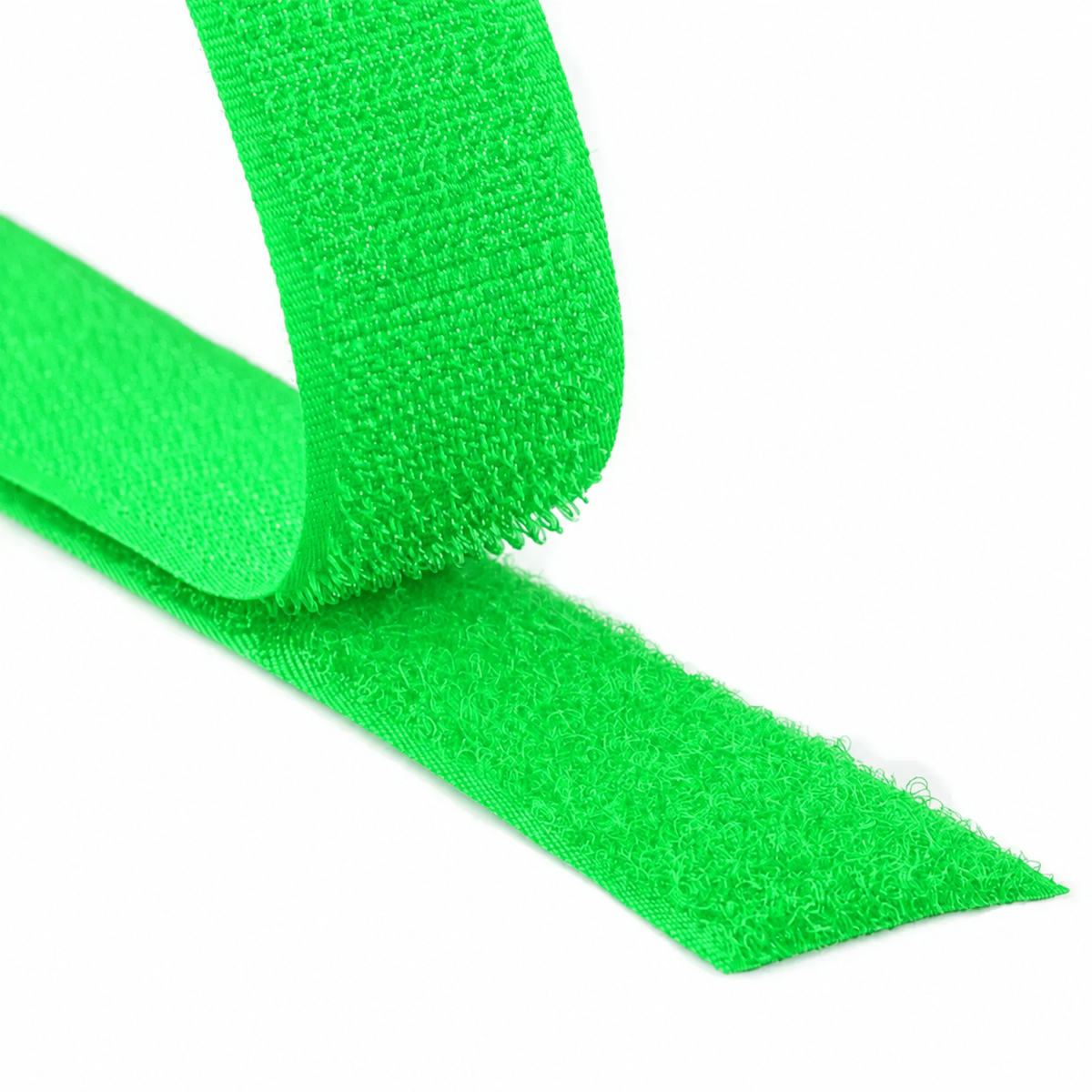 Close-up of a fluorescent green hook and loop fastener tape showing both hook and loop sides on a white background