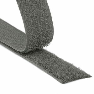 Close-up of a gray hook and loop fastener tape showing both hook and loop sides on a white background